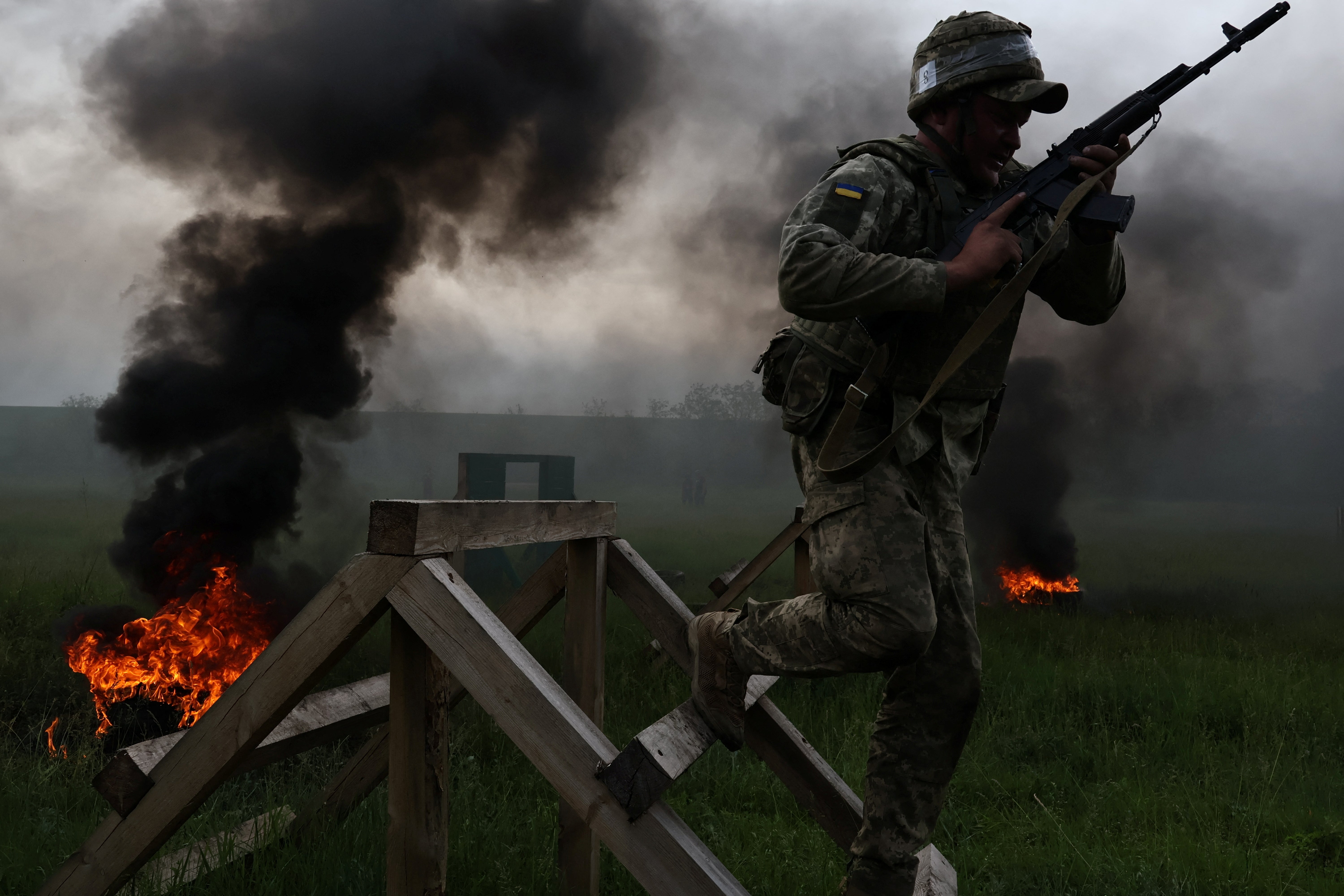 A serviceman of the 65th Separate Mechanised Brigade of the Ukrainian Armed Forces attends a military drill as a recruit near a frontline in Zaporizhzhia region in Ukraine
