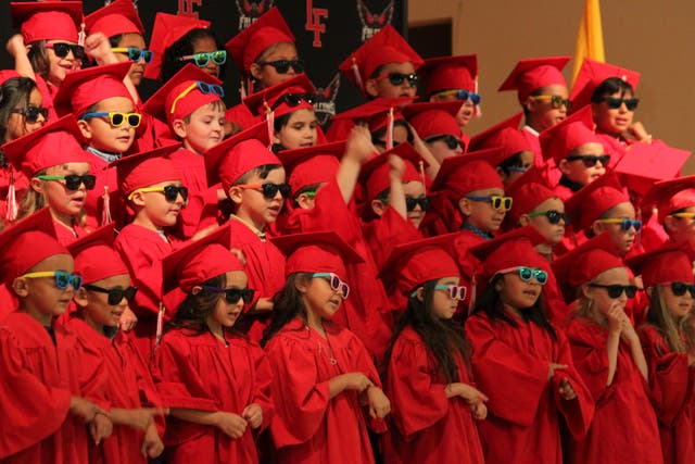 <p>Kindergartners perform during their graduation during a ceremony at the Loving Elementary School in Loving, New Mexico</p>