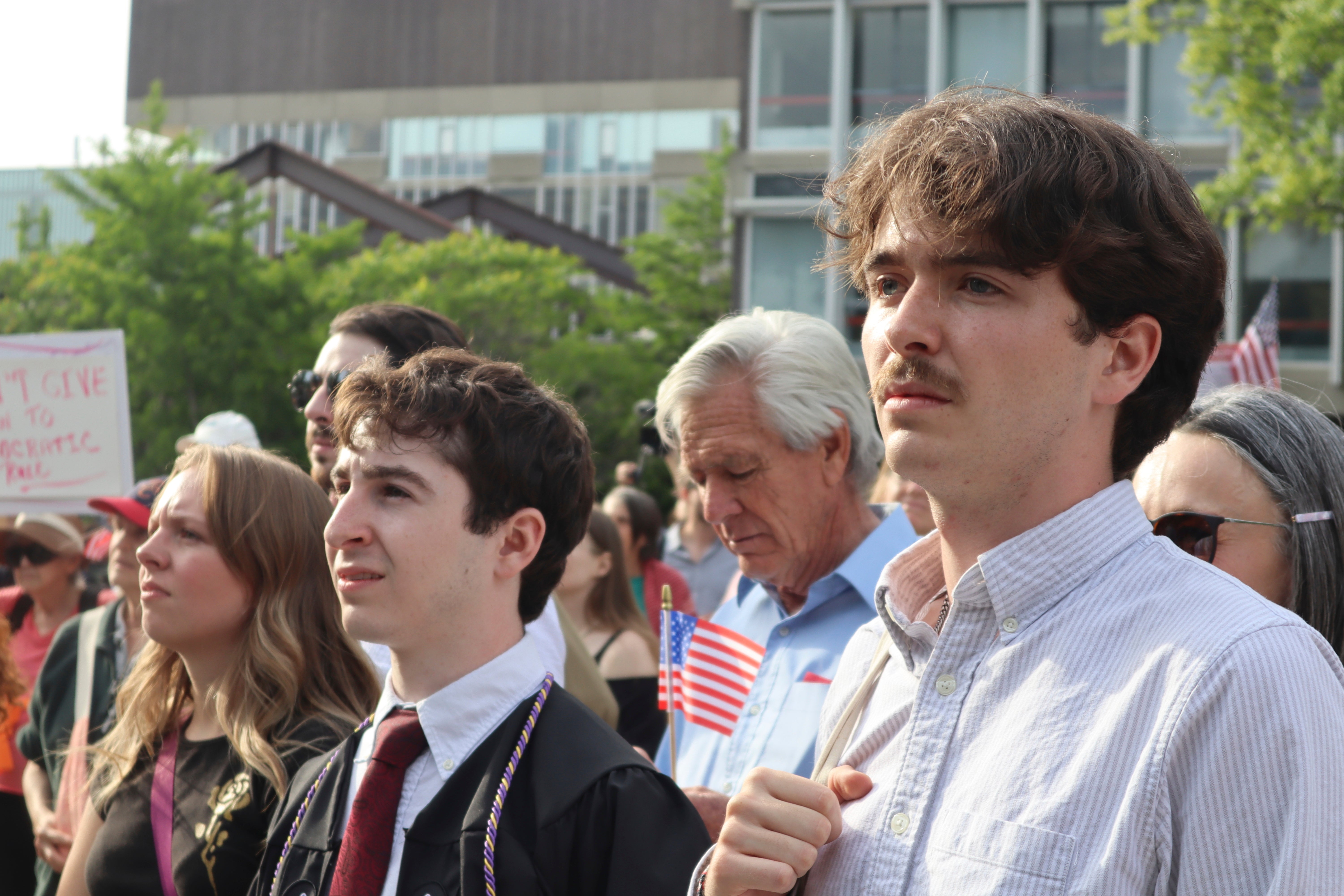 Protesters listen to Harvard University students speak during a demonstration against the Donald Trump administration’s recent sanctions on 27 May 2025