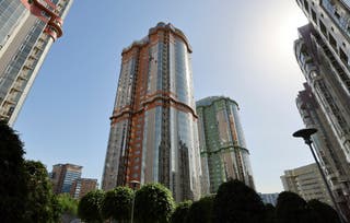 File: A damaged high-rise apartment building following a Ukrainian drone attack in Moscow