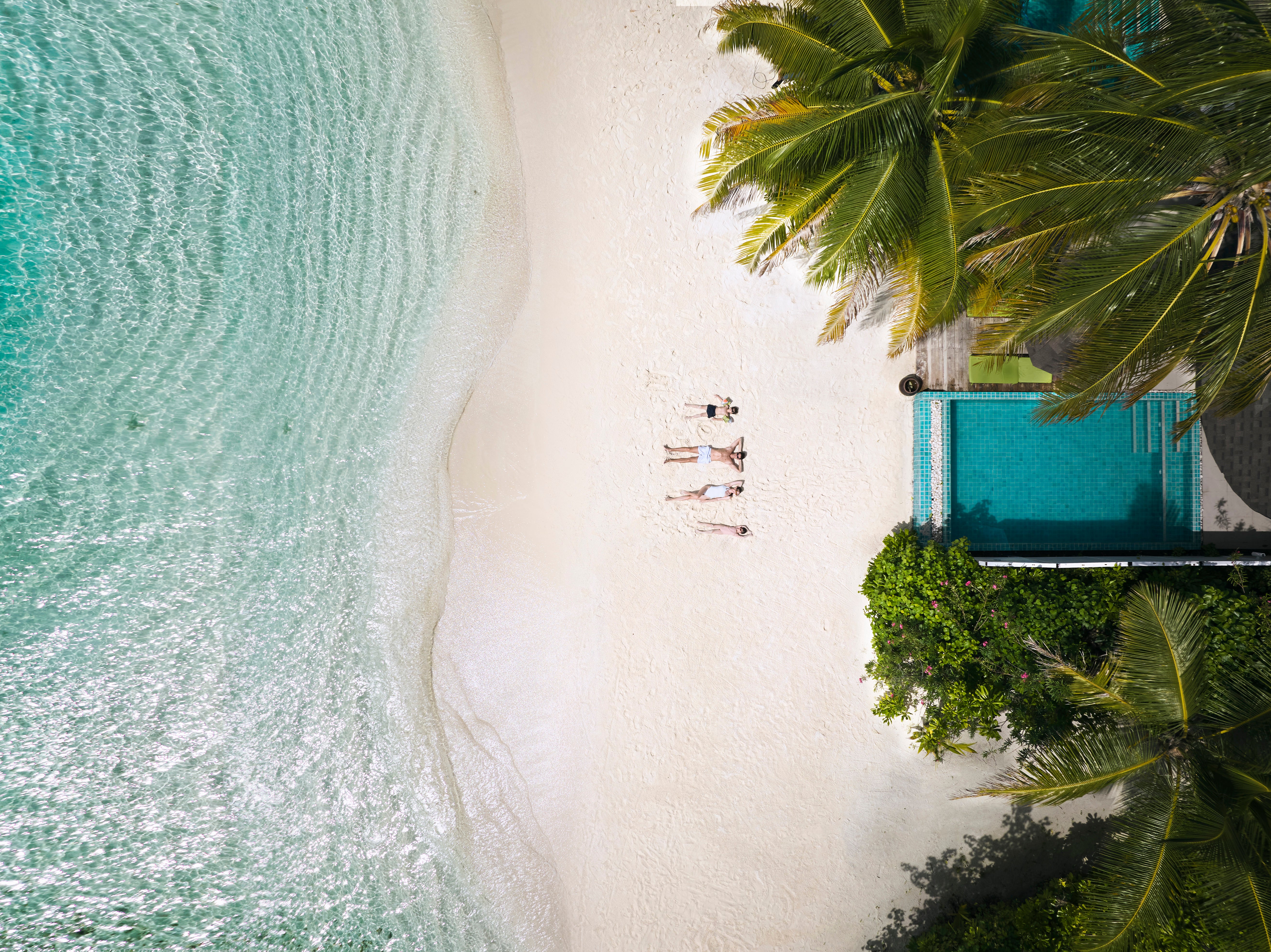 Sunbathe in style on the immaculate white sands of Centara Grand Phuket