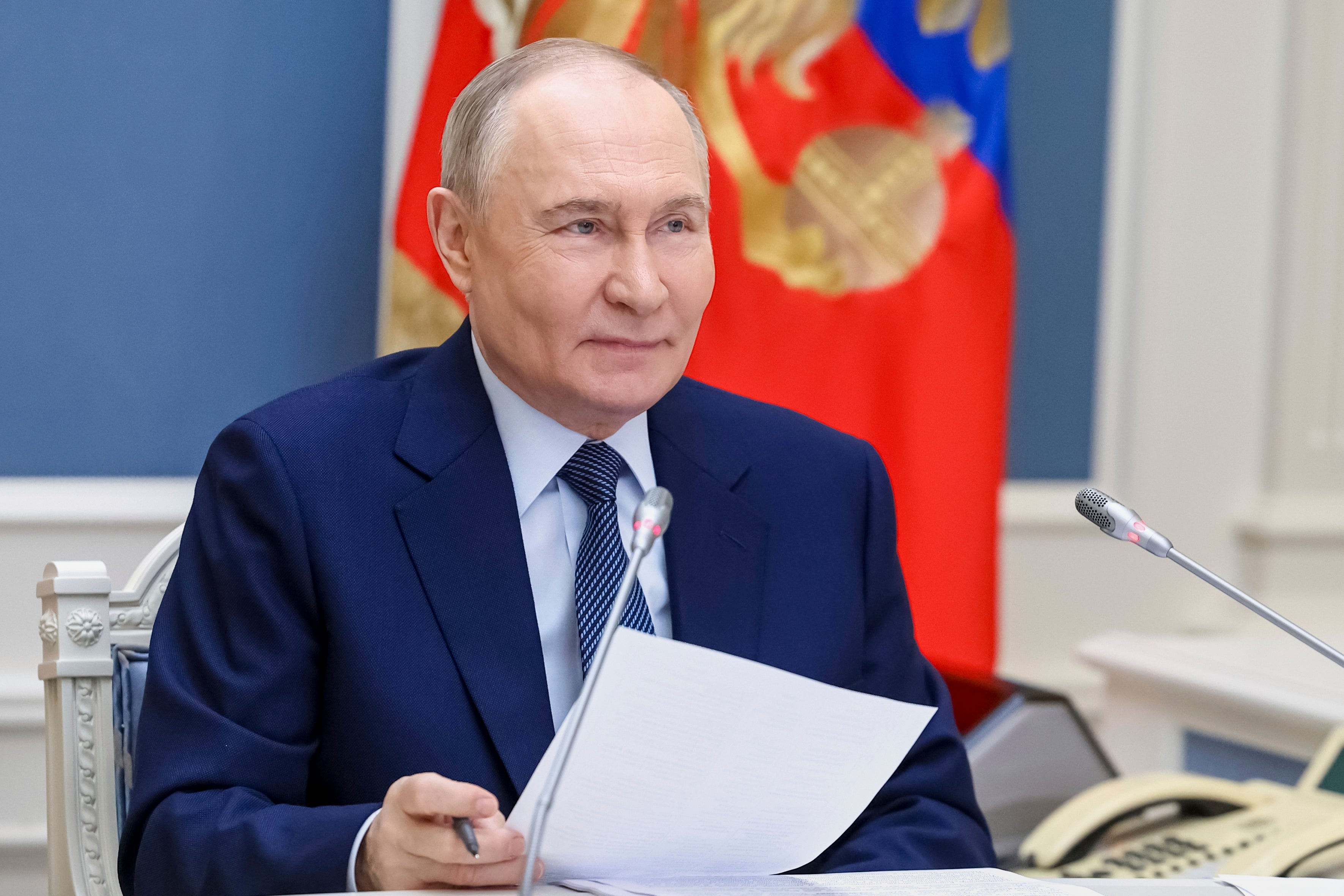 Russian President Vladimir Putin speaks to prominent families and mothers awarded with the Mother Heroine title ahead of the International Children's Day via videoconference at the Kremlin in Moscow, Russia, Thursday, May 29