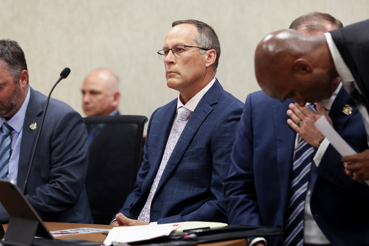 Judge throws out murder charge against Michigan officer who struck a fleeing man