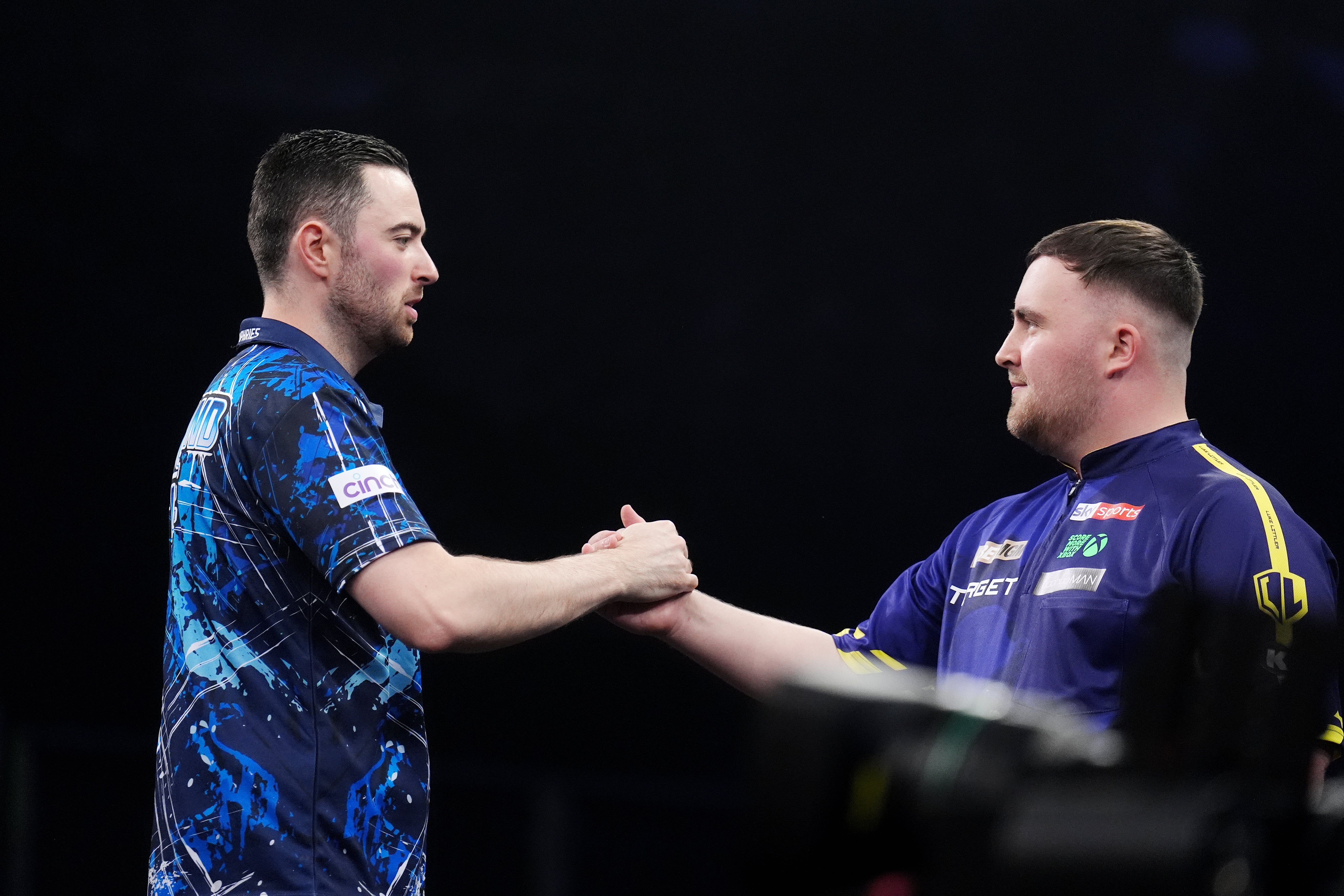 Luke Humphries, left, got the better of his great rival (John Walton/PA)