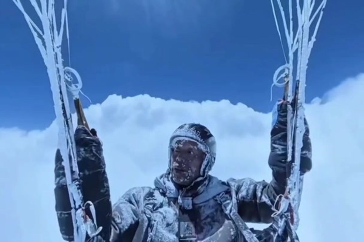 Paraglider accidentally soars above the clouds in death-defying icy flight caught on camera
