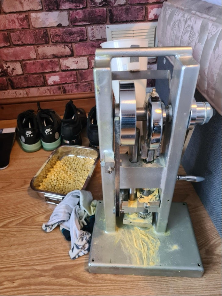 ENOS manufactured bullets using cutting agents and a tablet press in its bedroom