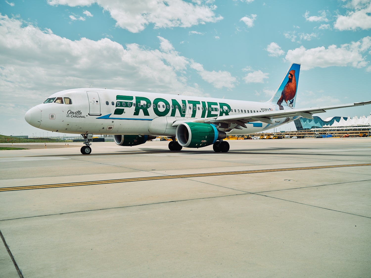 Frontier charges up to $99 for carry-on bags. The Frontier plane above is pictured at Denver International Airport