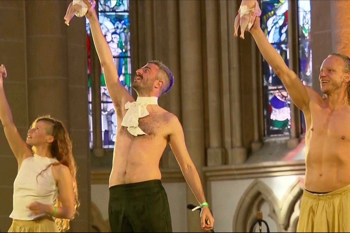 A show inside a cathedral featured raw chickens in diapers. The German president was in the audience