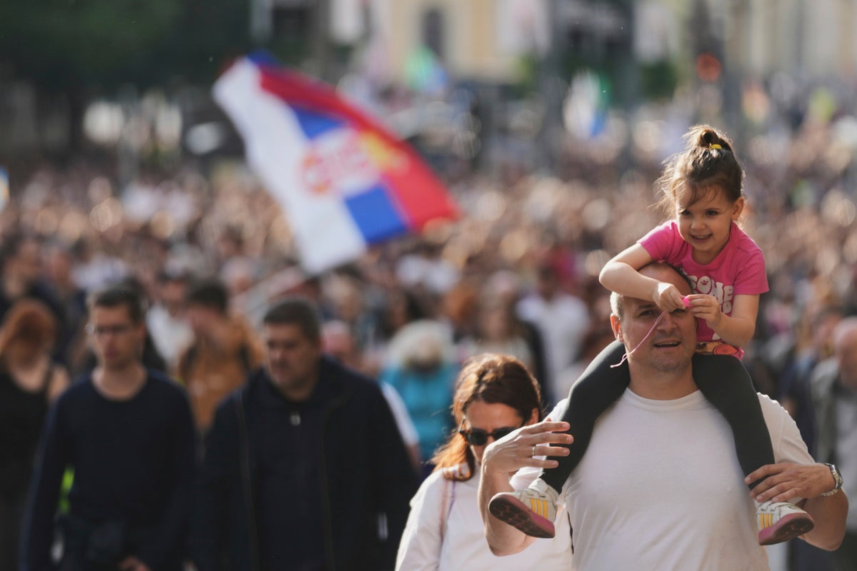 Thousands rally in Serbia's capital demanding snap elections after months of protests