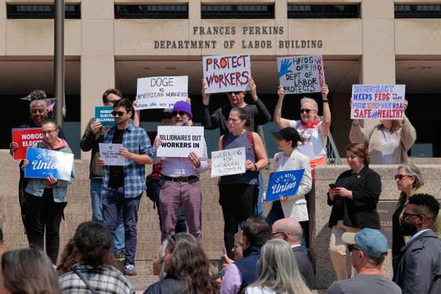 <p>Demonstrators rally during a press conference outside the Department of Labor headquarters on April 14 in Washington</p>