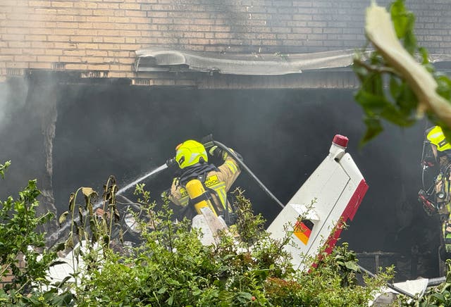 <p>Firefighters work at the crash site after an airplane crashed into a residential building, in Korschenbroich, Germany, Saturday, May 31, 2025. </p>