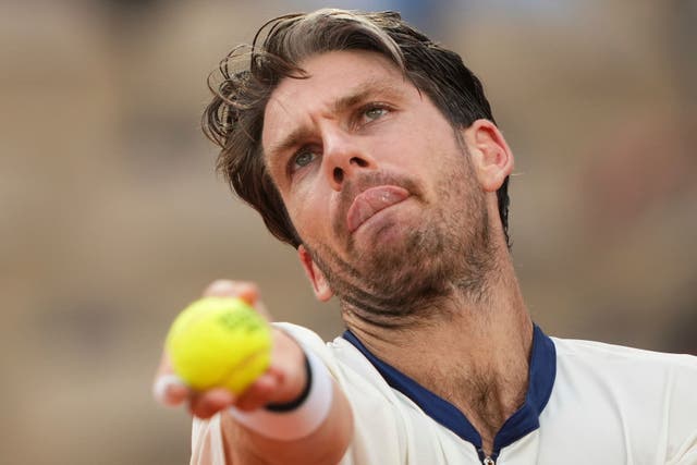 Britain’s Cameron Norrie serves against Jacob Fearnley (Lindsey Wasson/AP)