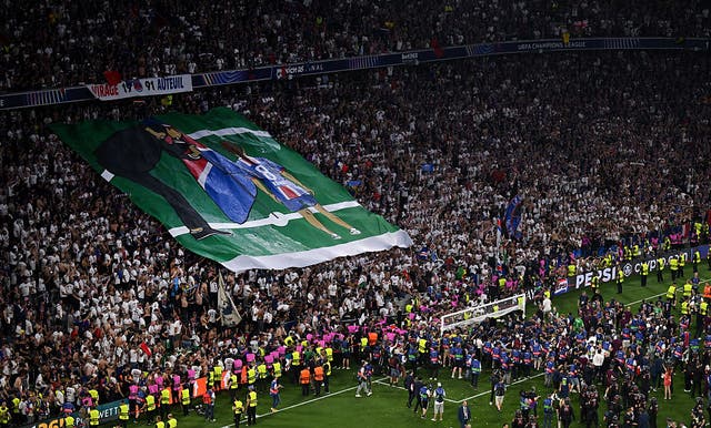 <p>Fans of Paris Saint-Germain display a banner in tribute to Xana Martinez</p>