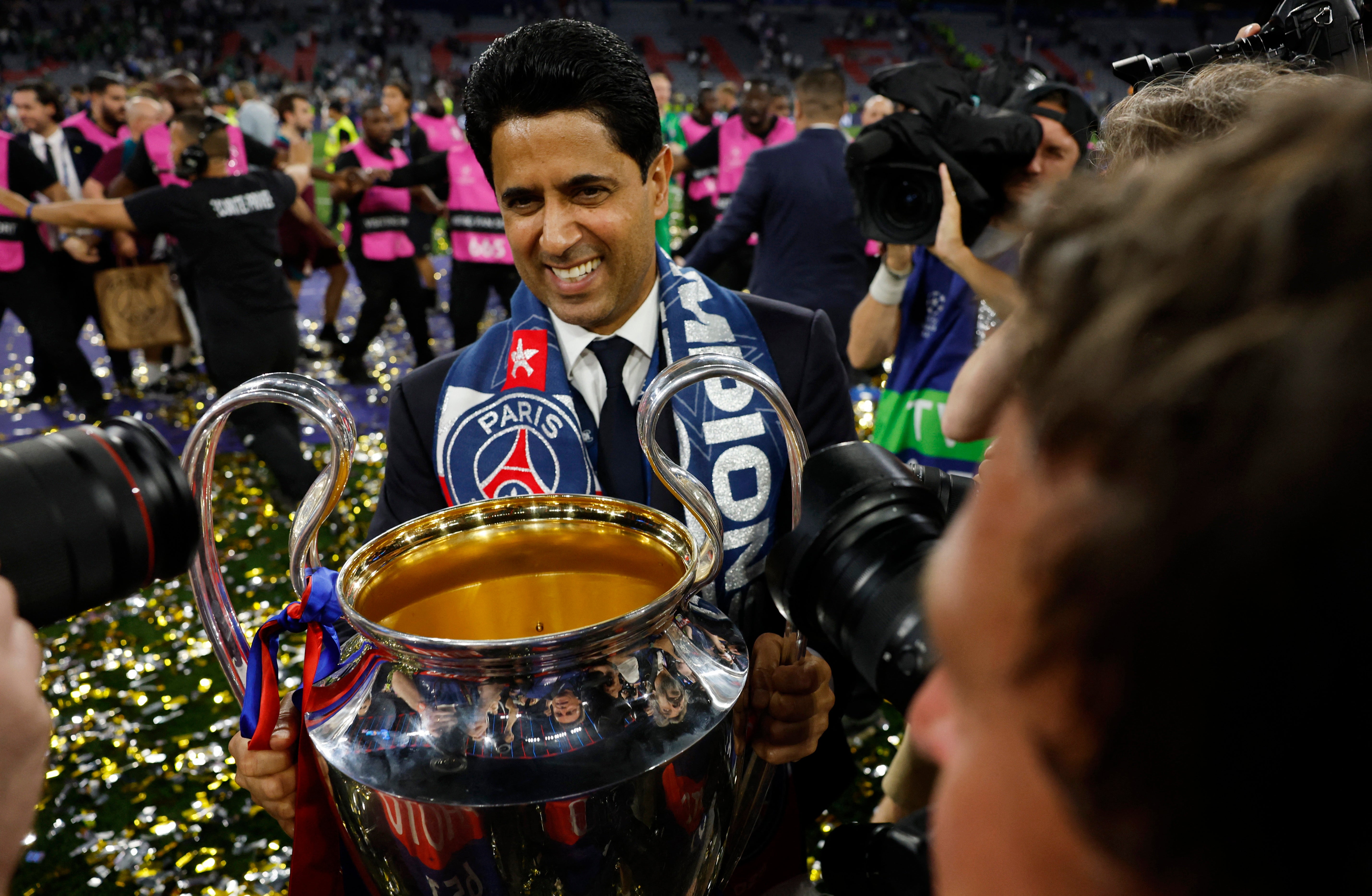 Nasser Al-Khelaifi holding the Champions League trophy