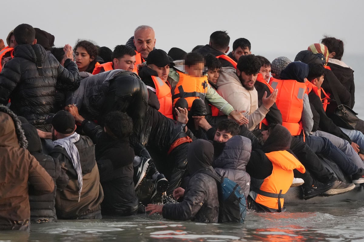 Watch: Migrants cling to overloaded small boat as over 1,000 cross Channel in one day