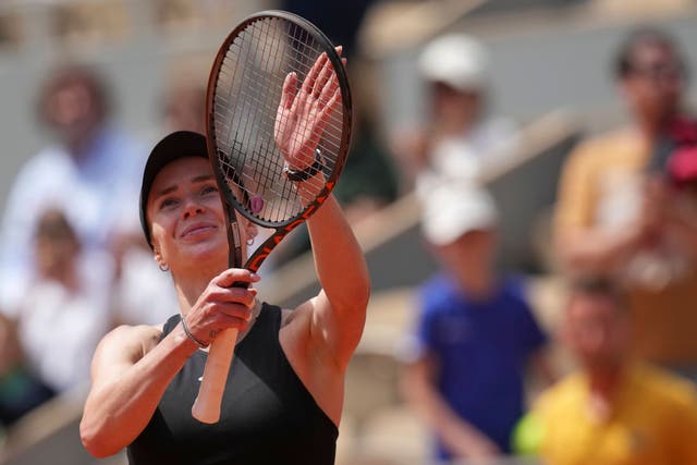 Elina Svitolina celebrates beating Jasmine Paolini (Christophe Ena/AP)