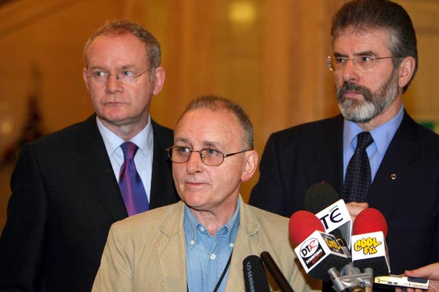 Denis Donaldson (centre) with Martin McGuinness and Gerry Adams in 2005 (Paul Faith/PA)