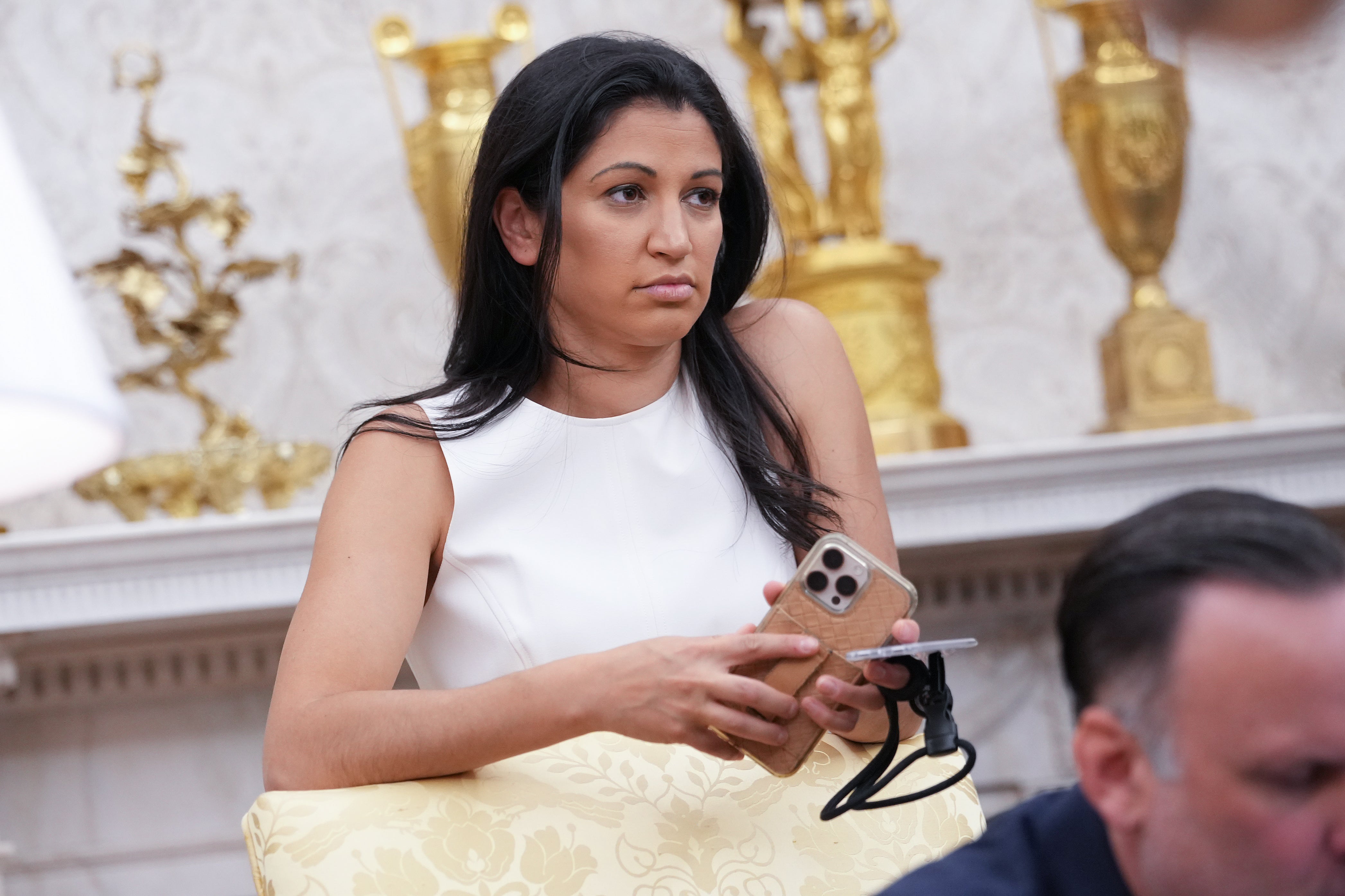 Katie Miller listens as U.S. President Donald Trump and Tesla CEO Elon Musk speak to reporters in the Oval Office of the White House on May 30, 2025 in Washington, DC. Musk. She is reportedly leaving the