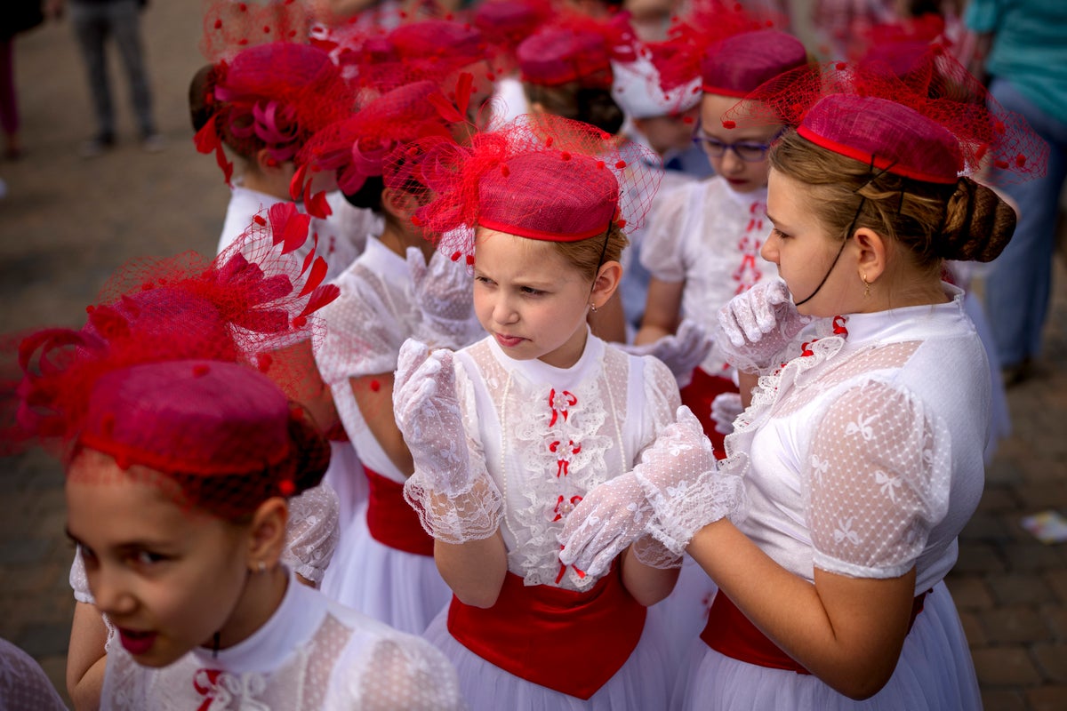 AP PHOTOS: Romanian children celebrate International Children’s Day at the Palace of Parliament