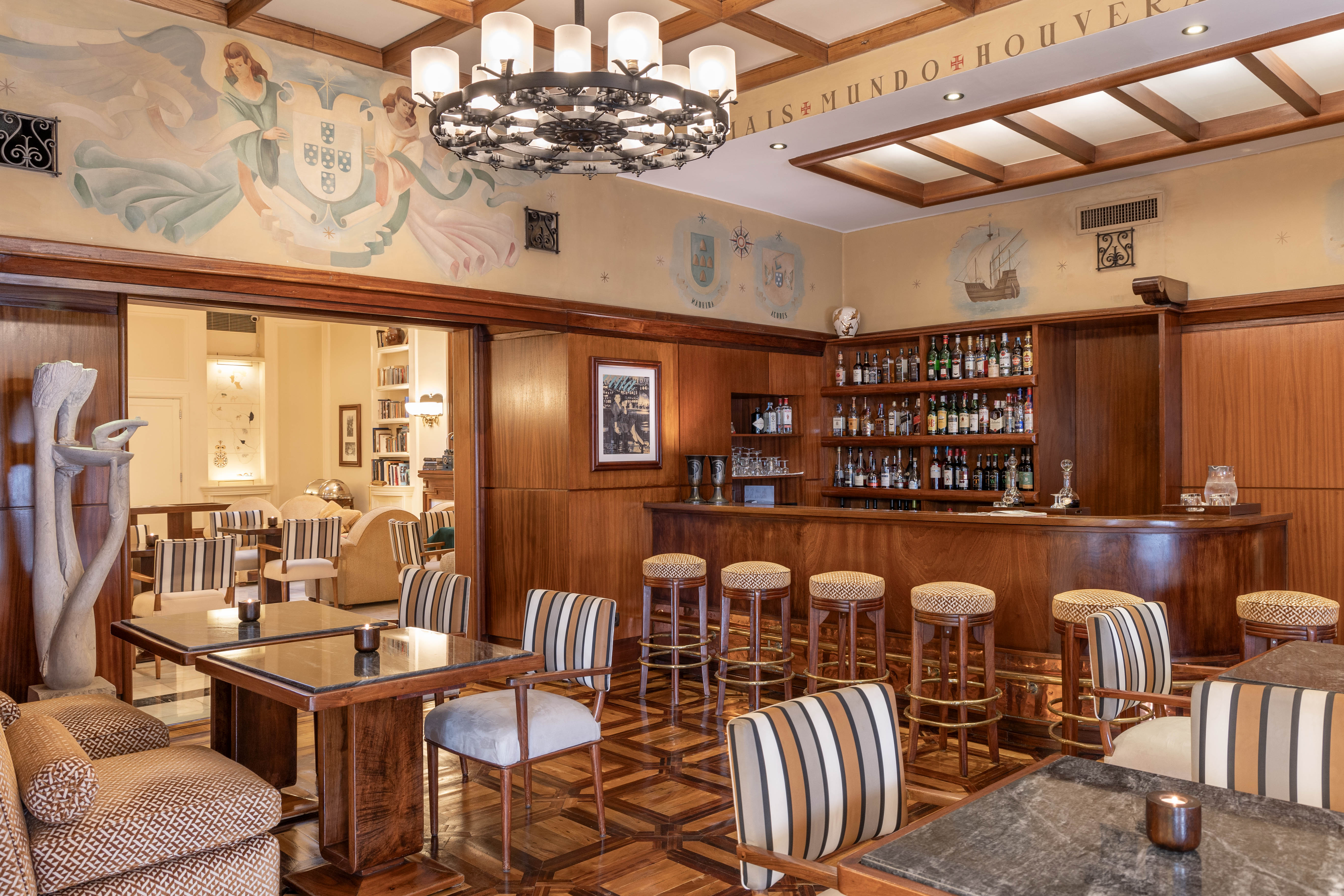 Sip your welcome drink in the sleek bar at Hotel Britania Art Deco