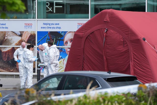 Forensic investigators at Fairgreen Shopping centre in Carlow, where a man died following a shooting incident on Sunday evening (Niall Carson/PA)