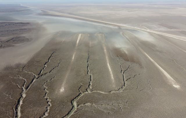 <p>An aerial photo shows an archaeological site where researchers uncovered massive earthen structures, believed to have been built with slave labor, and found that their construction spanned several centuries, near Basra, Iraq, Saturday, Jan. 29, 2022. (AP Photo/Jaafar Jotheri)</p>