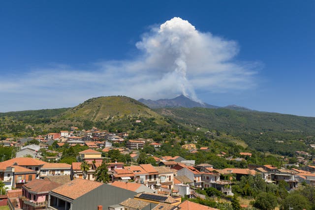 <p>A drone view shows volcanic stream rising from Mount Etna, as seen from Milo, Italy</p>
