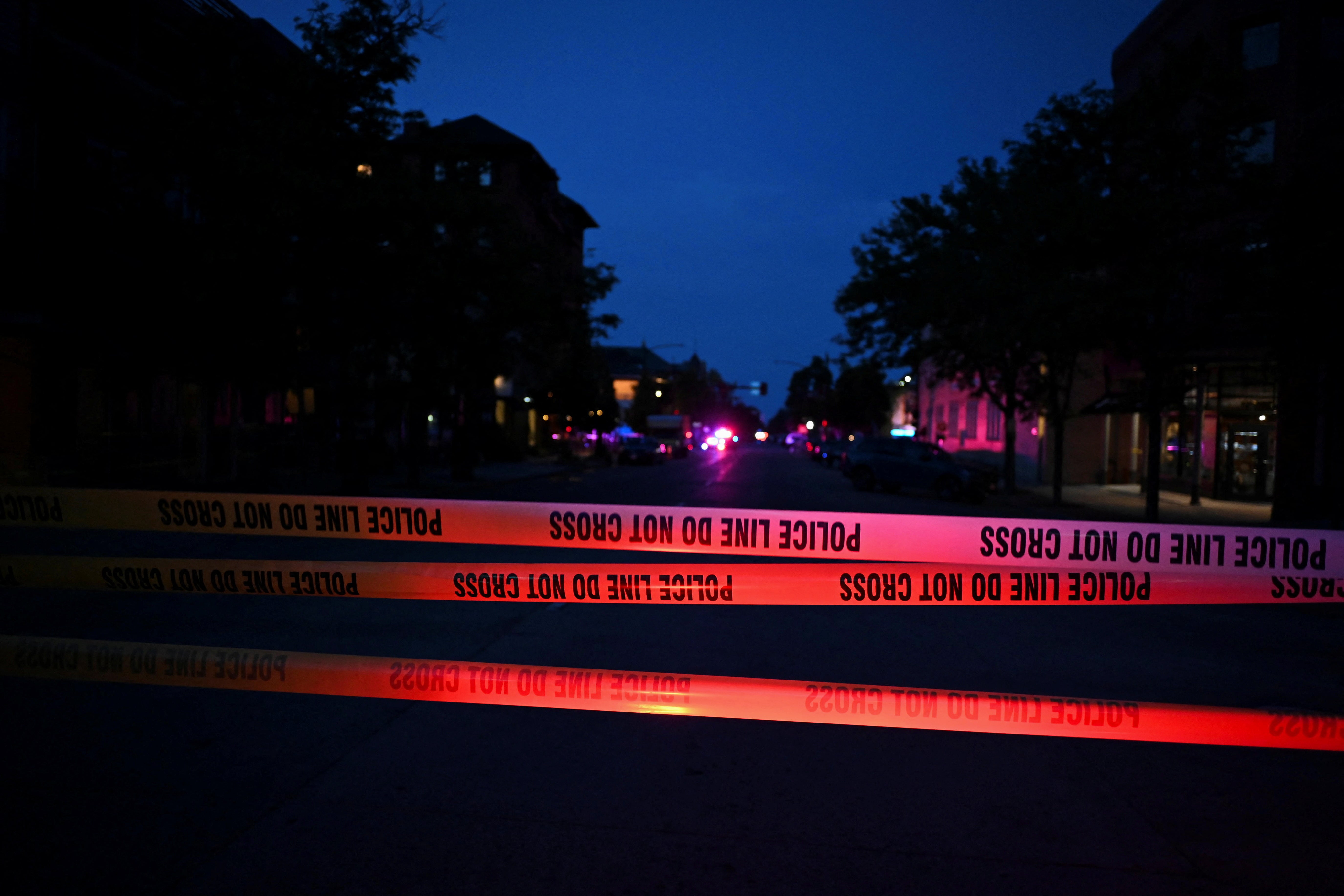 Emergency police lights illuminate a tape barrier near the scene of an attack that injured multiple people, in Boulder, Colorado, US, 1 June 2025