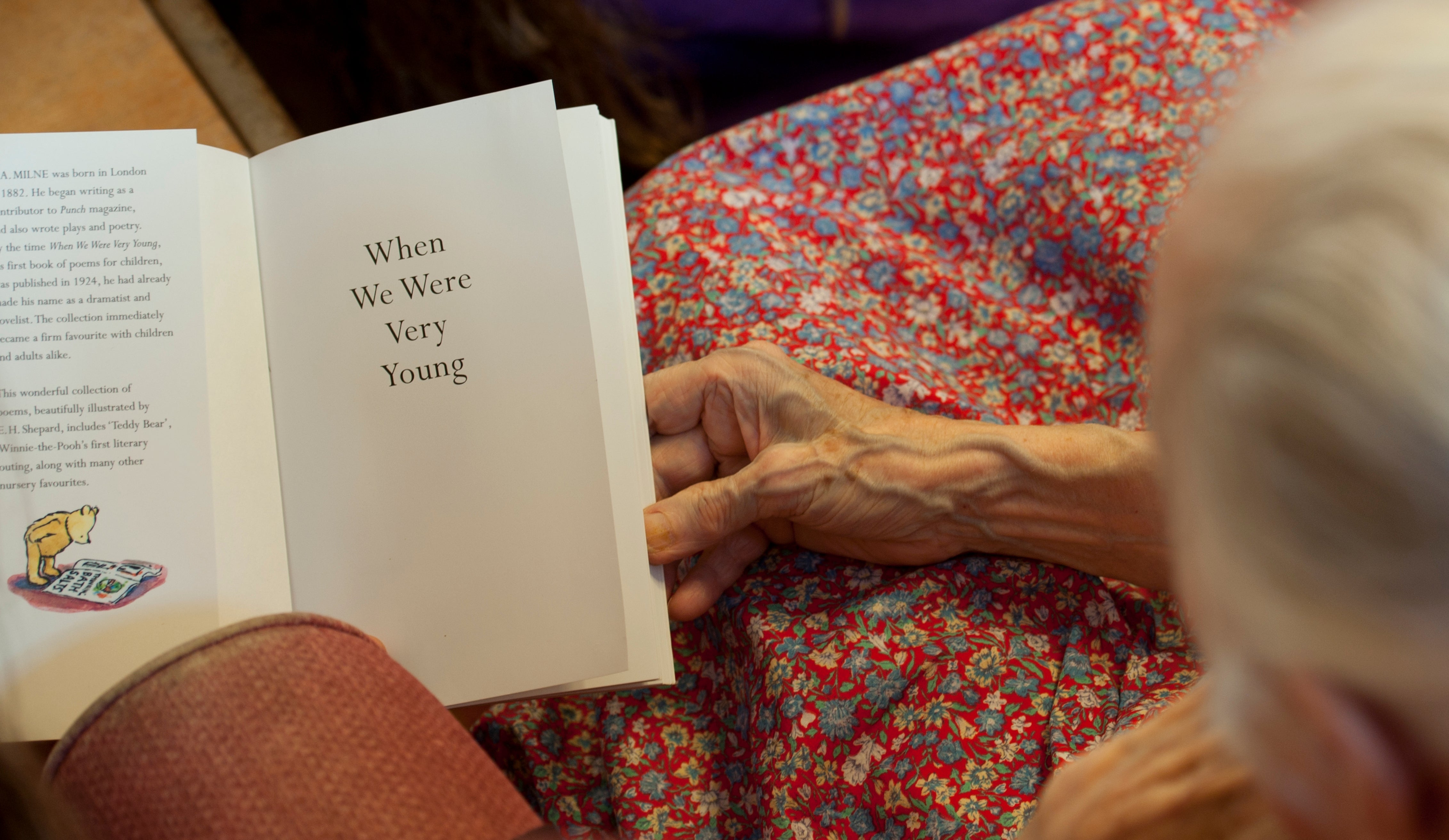 File. A volunteer reads poems to a resident with dementia at a retirement home in Stratford upon Avon