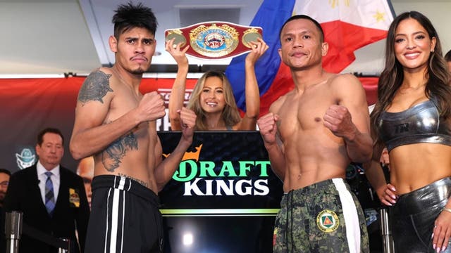 <p>Emanuel Navarrete and Charly Suarez at the weigh-in for their world-title fight on 9 May</p>