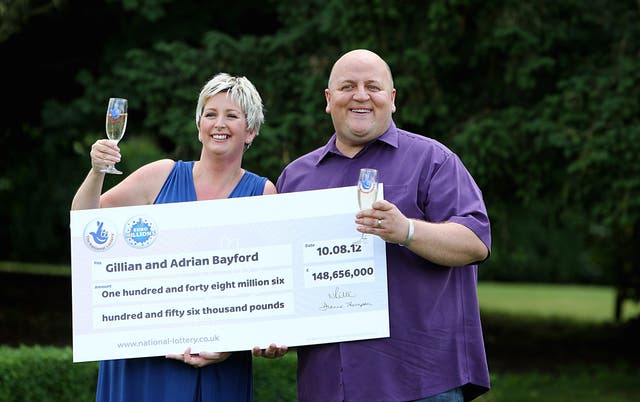 <p>Adrian Bayford, 41, and wife Gillian, 40, from Haverhill, Suffolk, at a press conference after they won £148.6 million in a EuroMillions jackpot (Sean Dempsey/PA)</p>