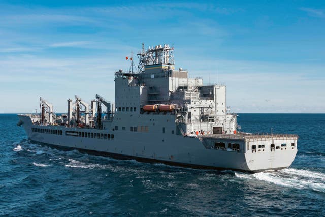 <p>The John Lewis-class replenishment oiler USNS Harvey Milk conducts a replenishment at sea in the Atlantic Ocean in December 2024</p>