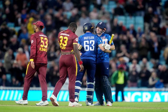 Jos Buttler and Harry Brook celebrate England’s victory (Adam Davy/PA)