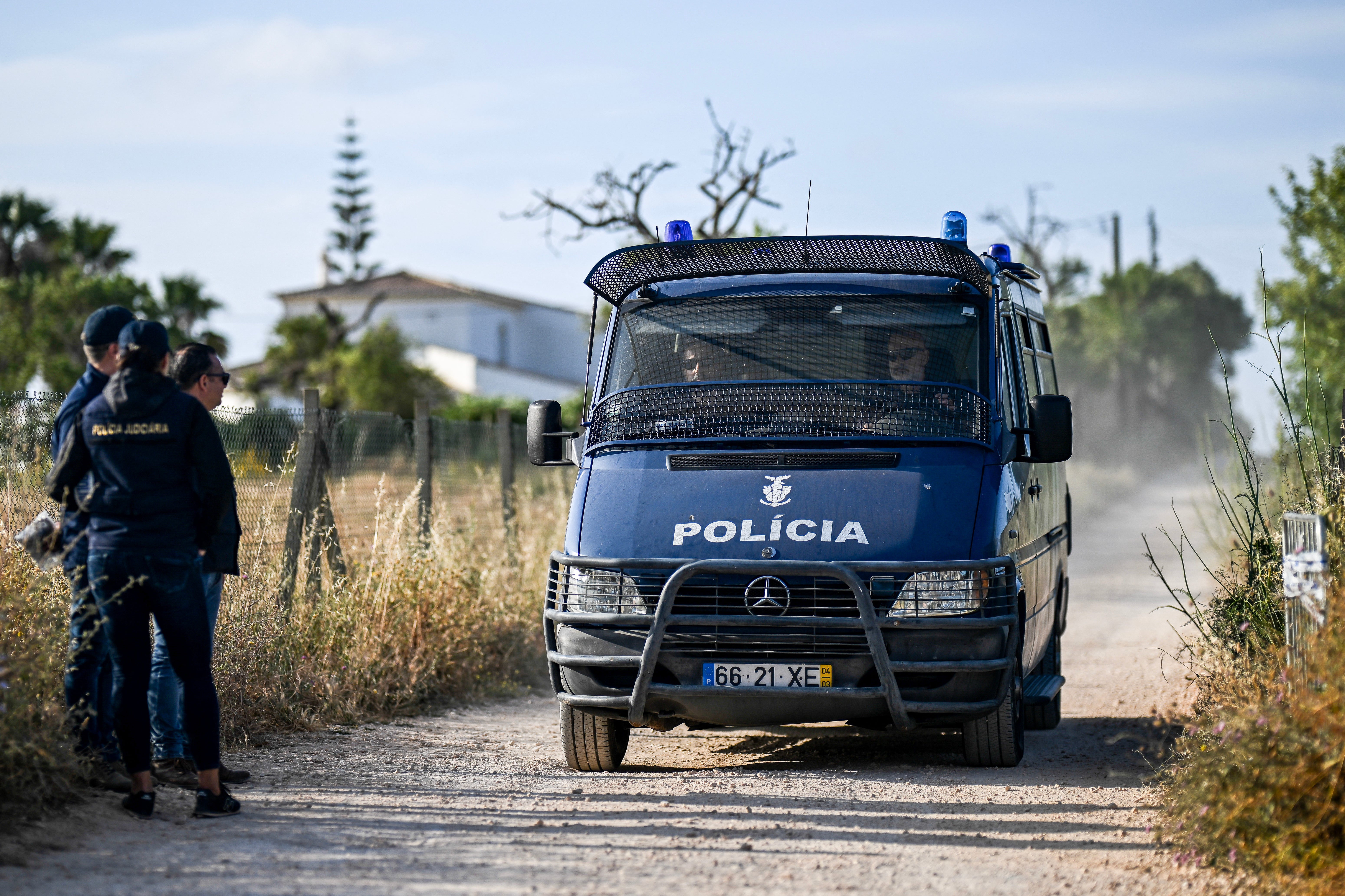 Portuguese Investigation Police arrive in a van on the site of a new search