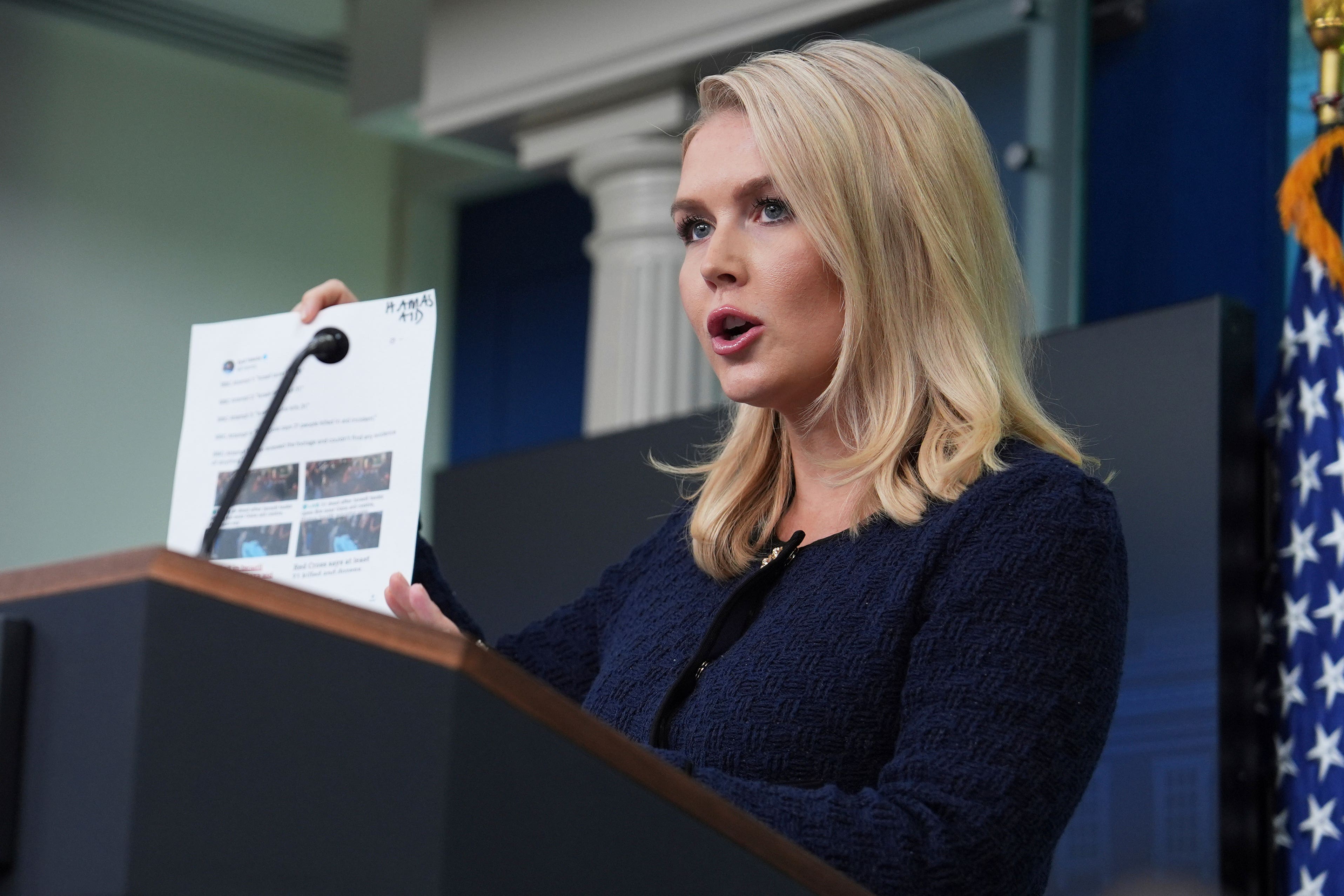 White House press secretary Karoline Leavitt holds up BBC headlines during a briefing at the White House (Evan Vucci/AP)