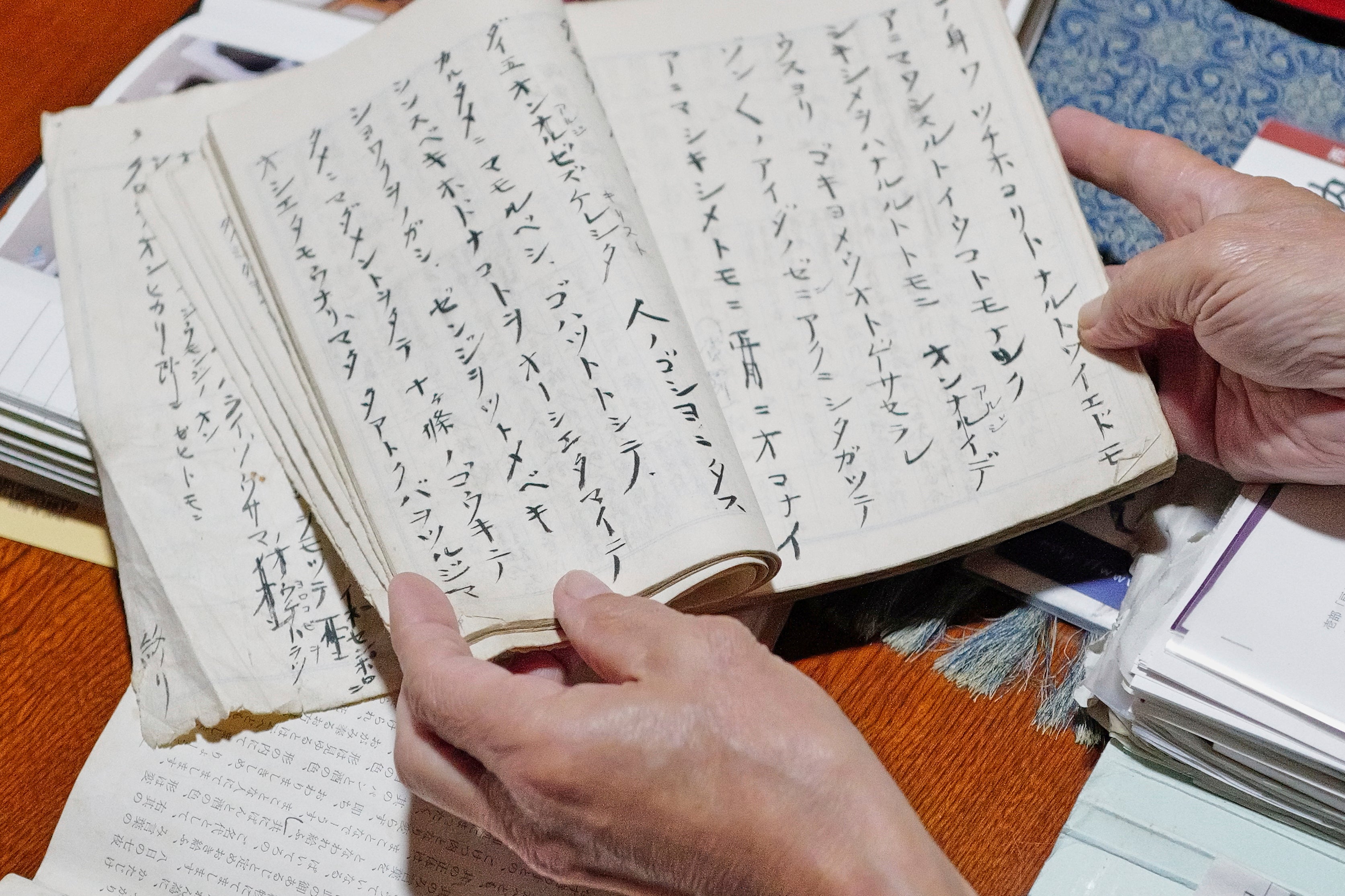 A notebook of handwritten “orasho” prayers passed down orally for generations