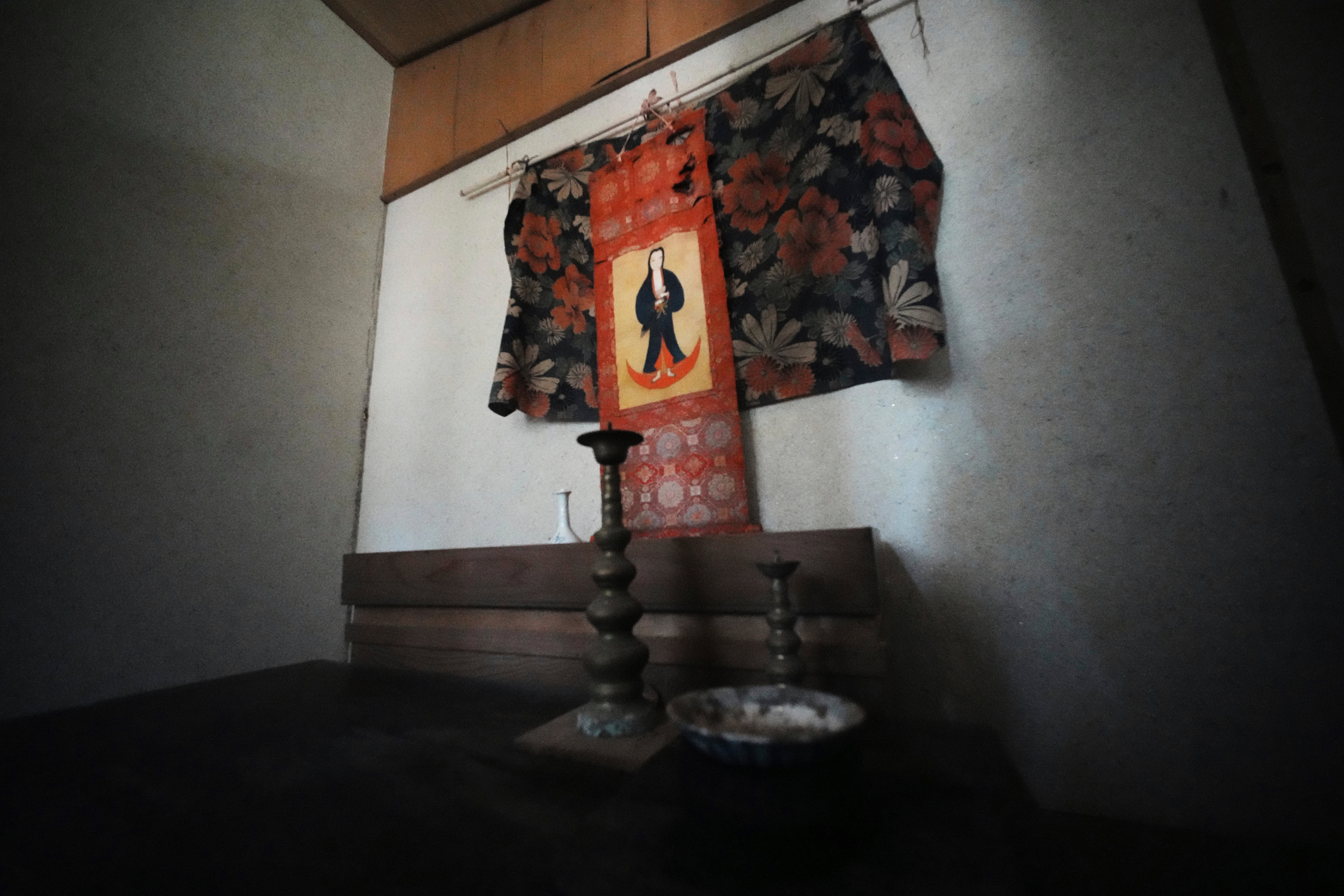 A scroll of the Virgin Mary and Jesus, once secretly worshipped, hangs at a home