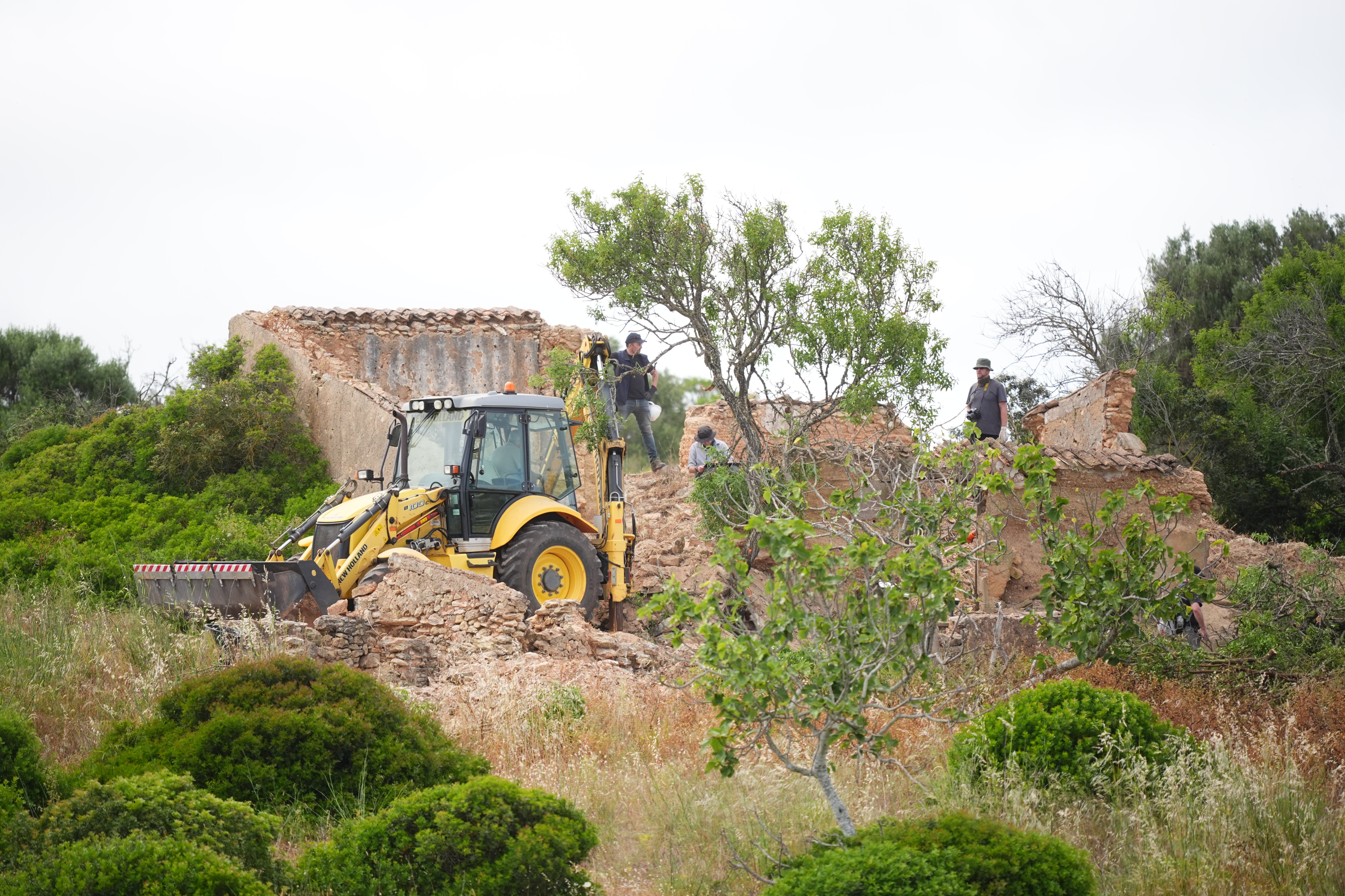 A digger was used to move rubble during the search