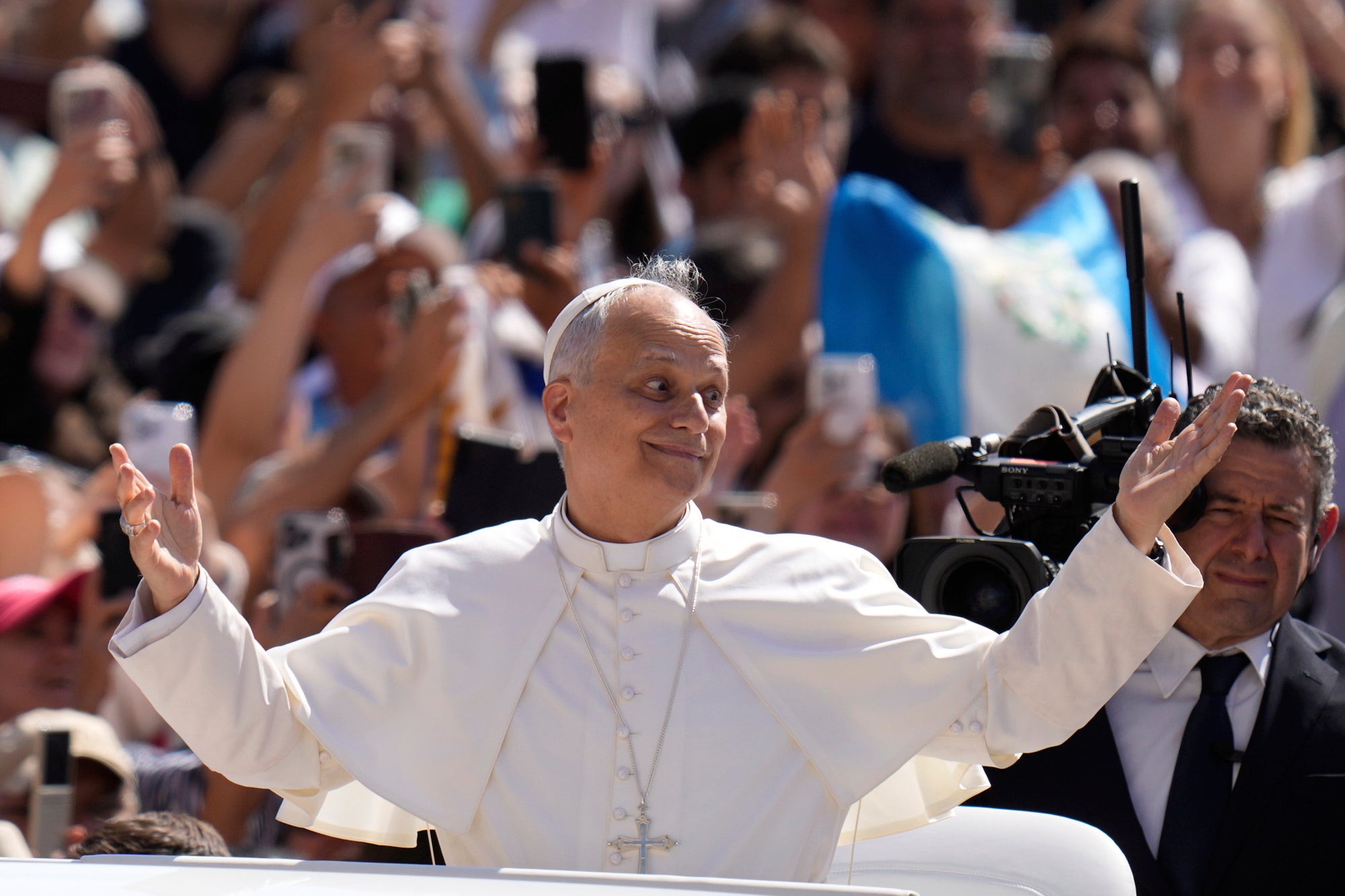 Pope Leo XIV gestures as he arrives for his weekly general audience in St. Peter's Square at The Vatican, Wednesday, June 4, 2025