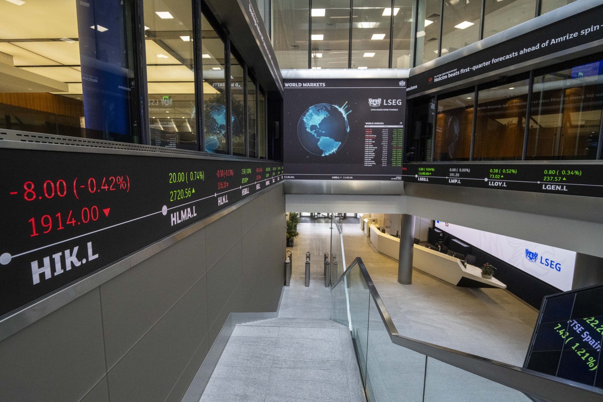 FTSE 100 closes higher after survey shows UK services sector returned to growth