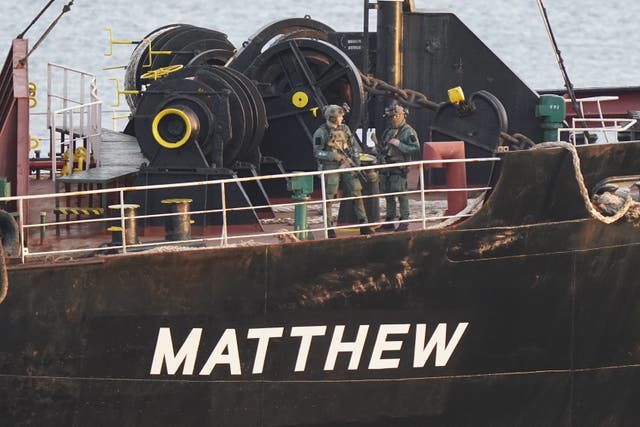 Military personnel onboard a cargo vessel named MV Matthew whilst it was escorted into Cobh in Cork by the Irish Navy (Niall Carson/PA)