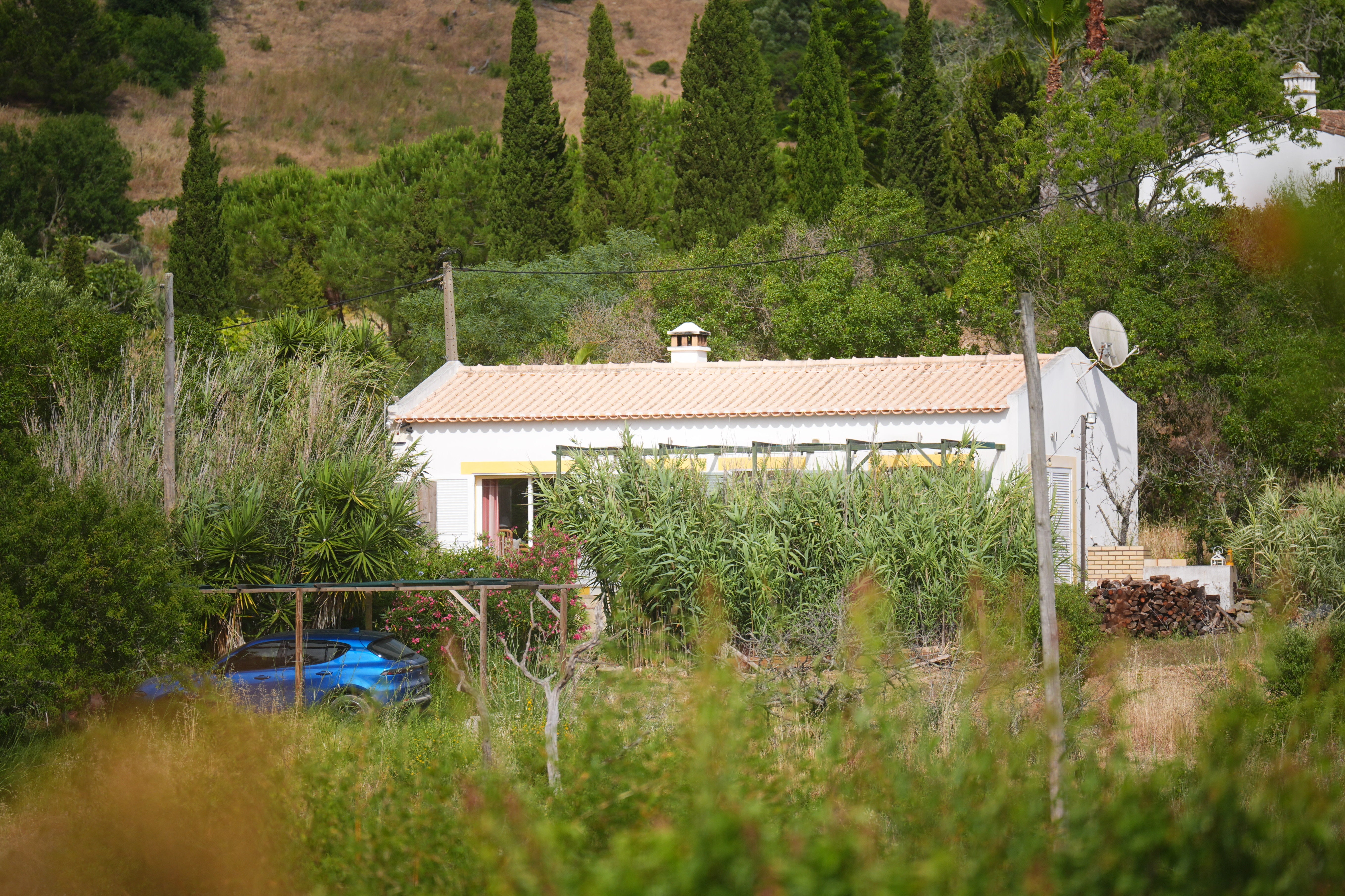 The cottage was close to the large area of scrubland being searched by police this week