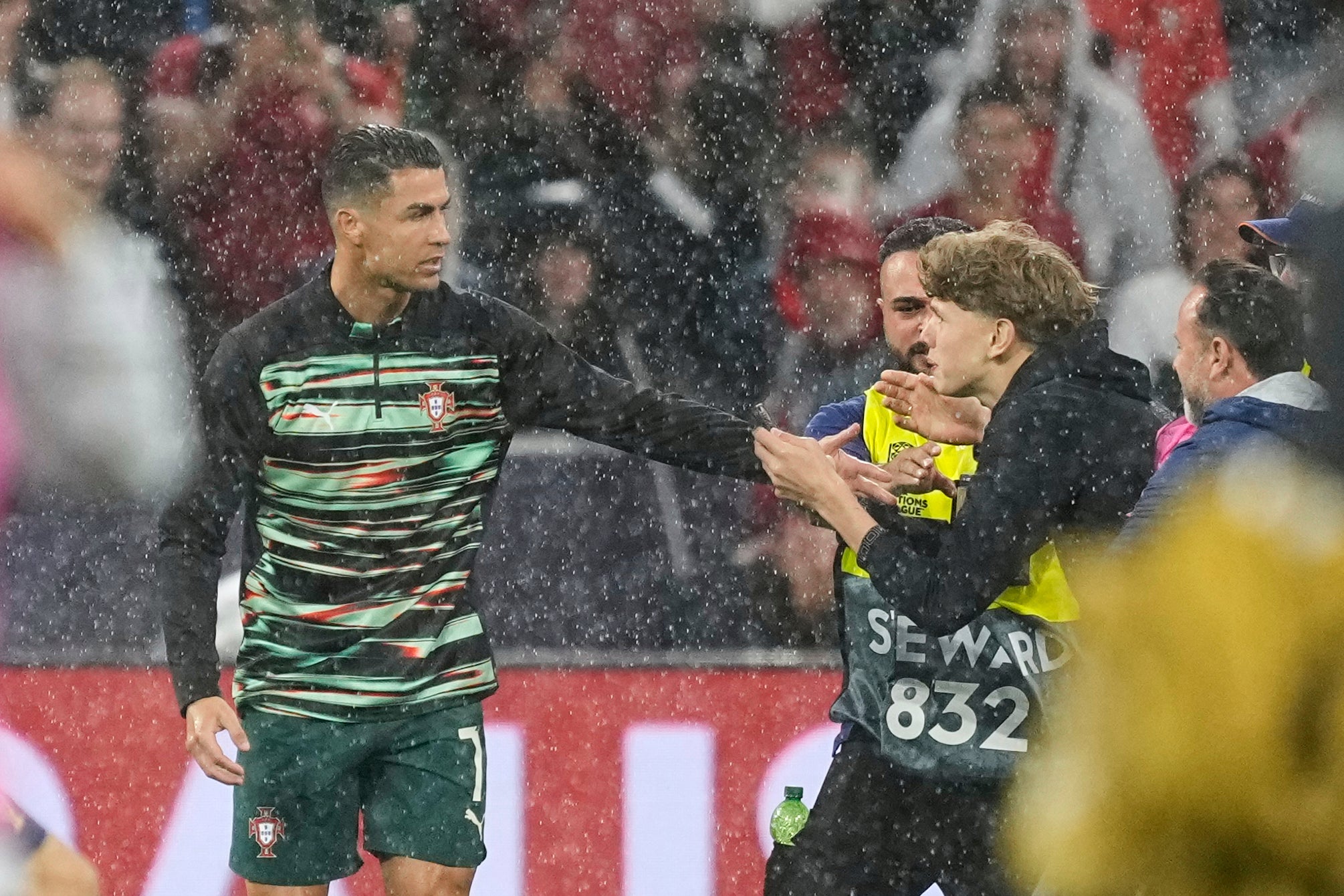 A fan confronted Ronaldo before kick-off (Martin Meissner/AP)