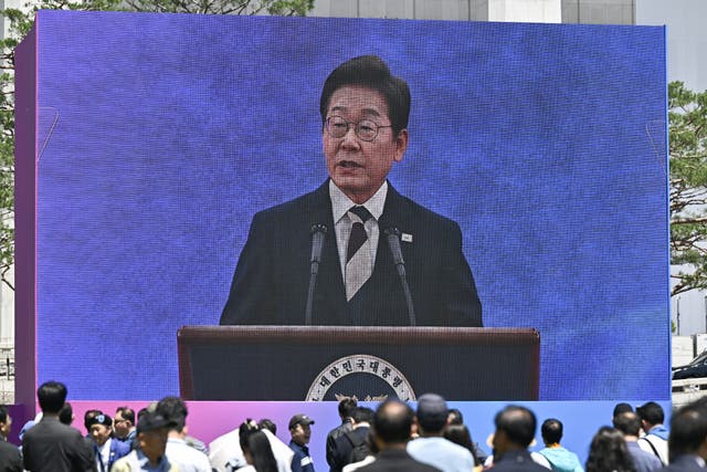 <p>People watch the inauguration ceremony of South Korea's president Lee Jae Myung outside the National Assembly in Seoul on 4 June 2025</p>