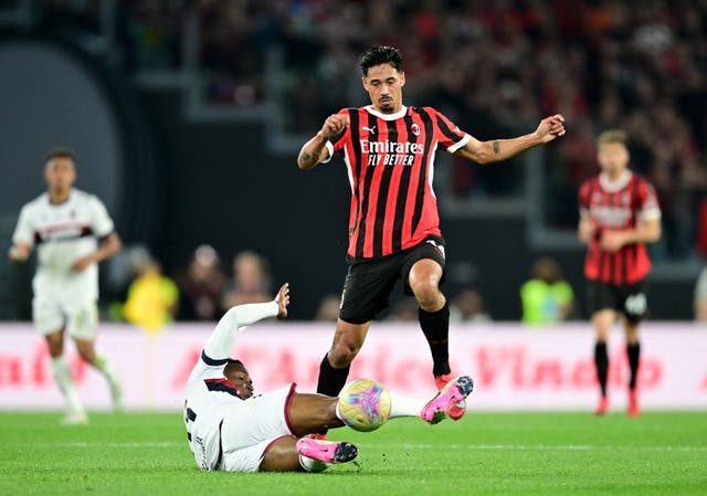 <p>AC Milan's Tijjani Reijnders in action with Bologna's Jhon Lucumi </p>