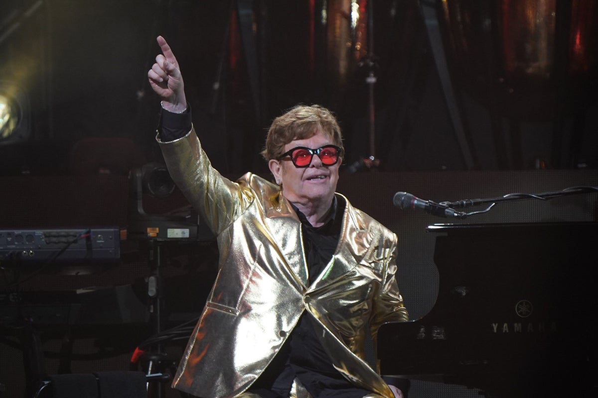 Elton John says ‘we will not back down’ in awards speech addressing AI concerns