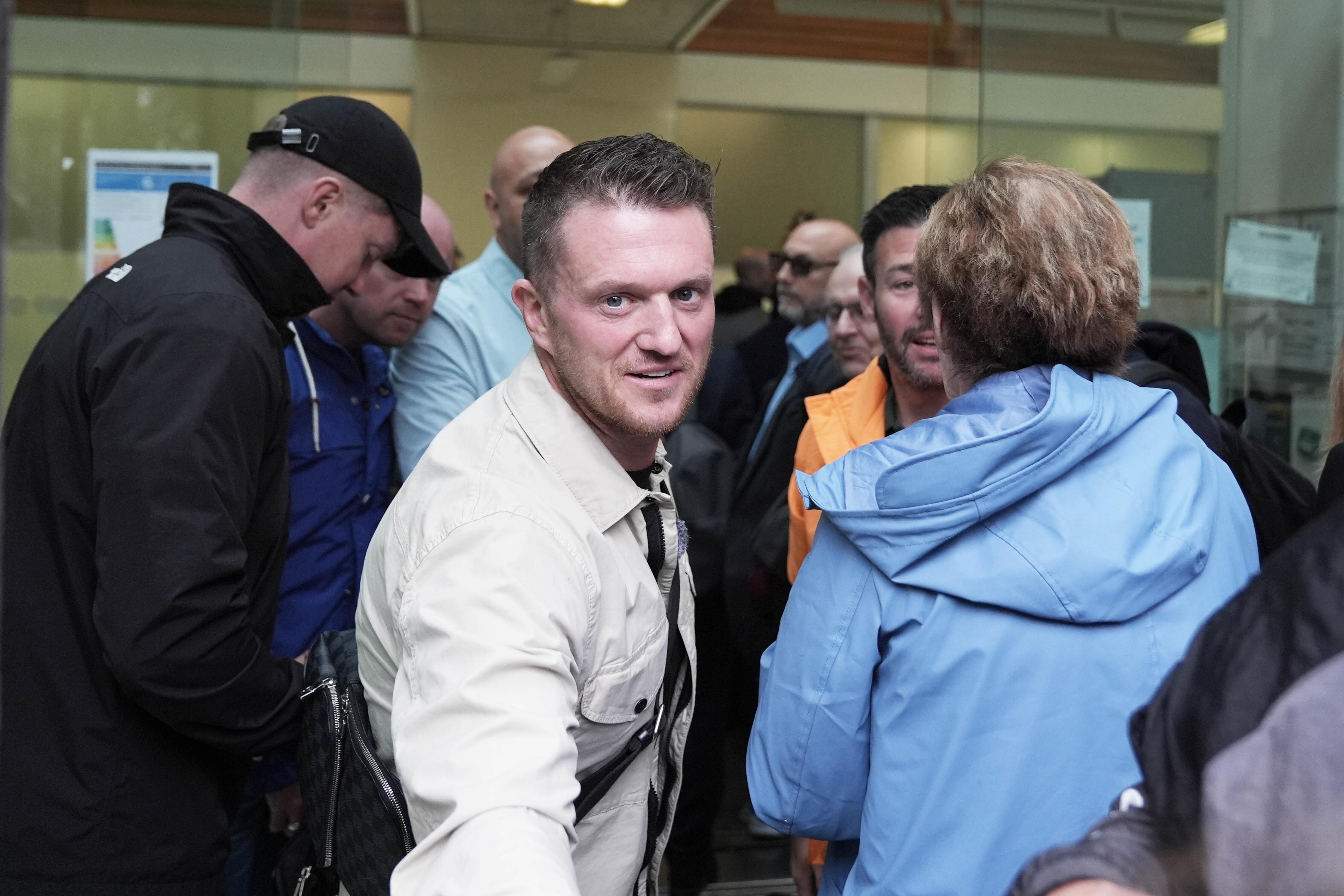 Tommy Robinson, centre, outside Westminster Magistrates’ Court (Maja Smiejkowska/PA)