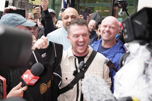 Tommy Robinson (centre), pleaded not guilty to two counts of harassment causing fear of violence (Maja Smiejkowska/PA)