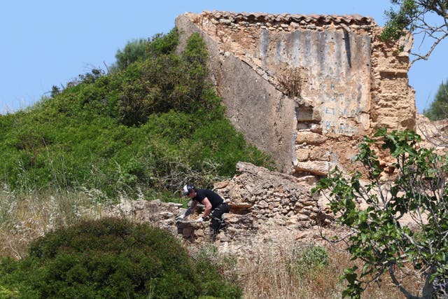 <p>A criminal police investigator searches the area near a ruin as police resumes the search for the body of Madeleine McCann, who went missing in the Portuguese Algarve in May 2007, in Atalaia, Portugal, June 5, 2025. REUTERS/Pedro Nunes</p>