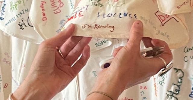 <p>A feminist activist unpicked the stitching covering JK Rowling's name </p>